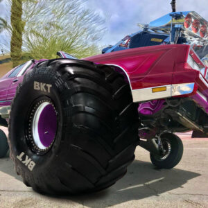 Collage of a lowrider vehicle with a monster truck tire and oversized engine